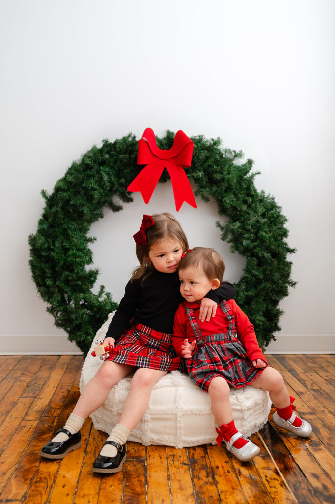 Siblings photographed with Santa