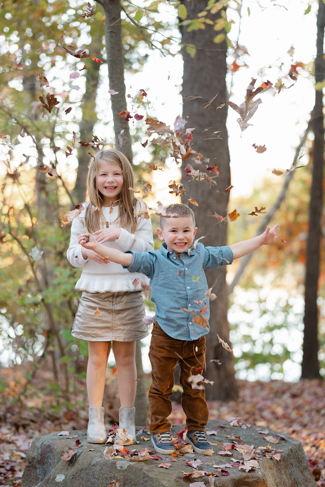 siblings posing for fall photos